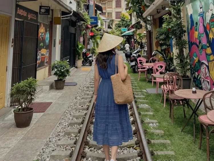 Stylish women exploring Vietnam in fashionable travel outfits