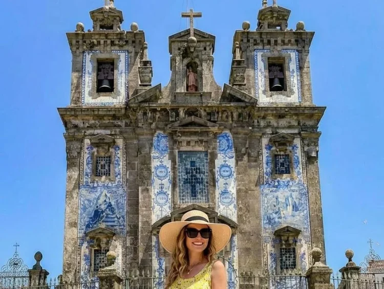 A stylish woman wearing bold prints in a scenic Portuguese setting